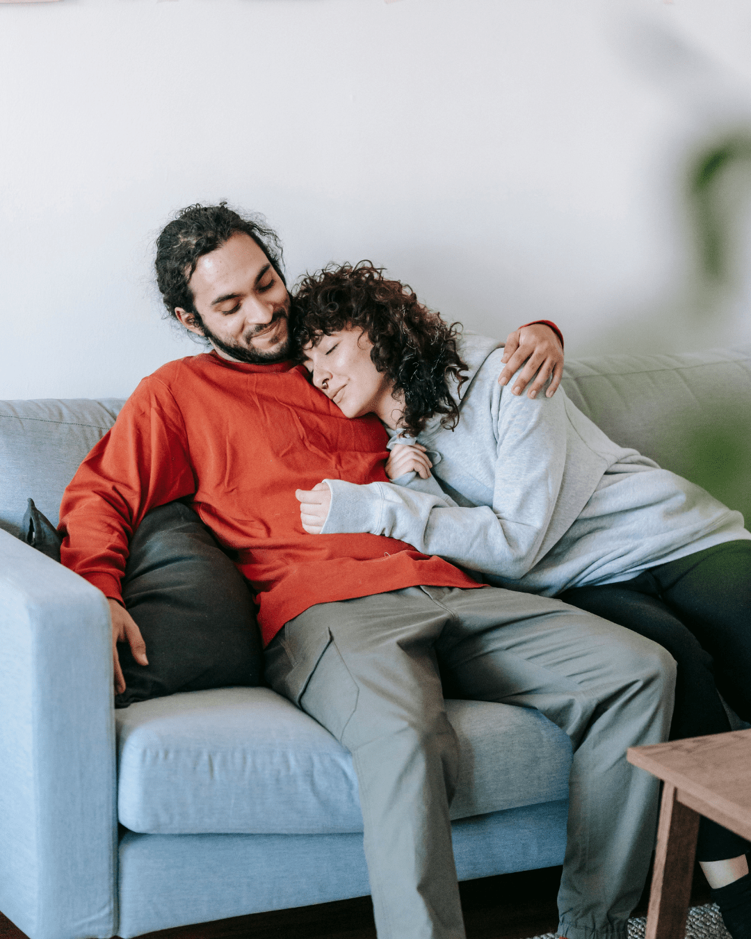 Couple comforting each other after a family visit, showing support and connection