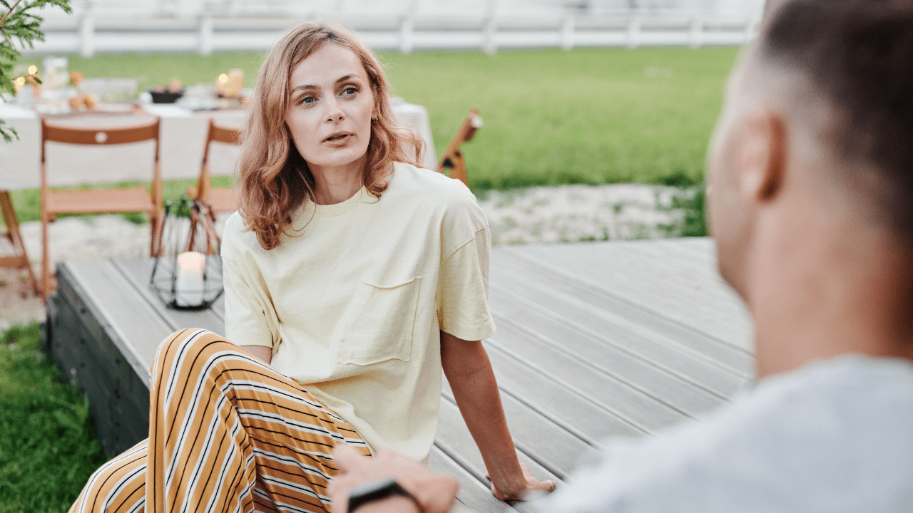 Couple discussing relationship anxiety, trust, and emotional connection outdoors