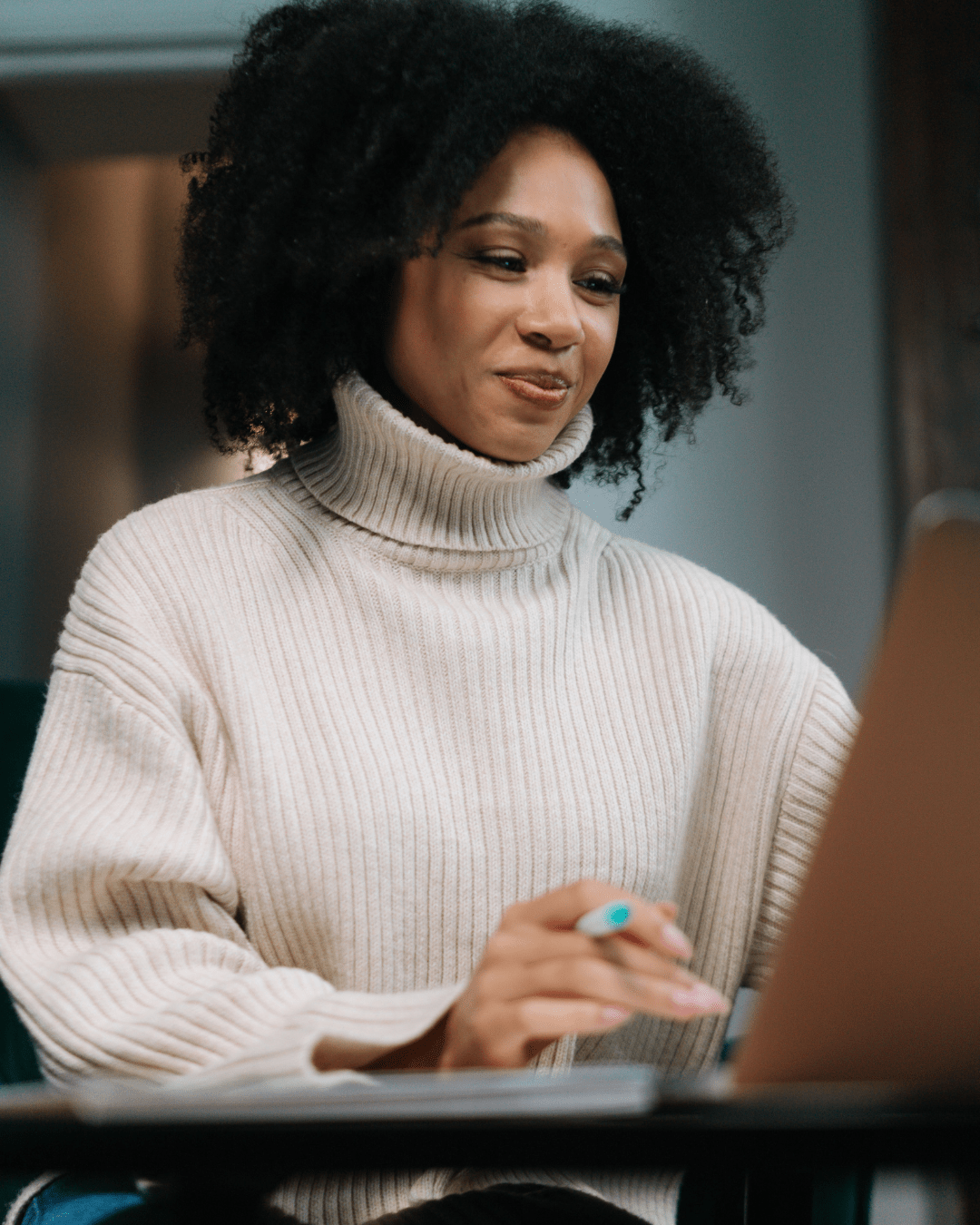 Woman using a laptop while at home during individual therapy
